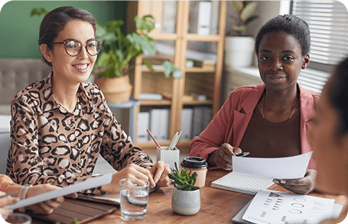 Team of successful female professionals in meeting